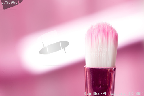 Image of close-up pink professional cosmetic brush 