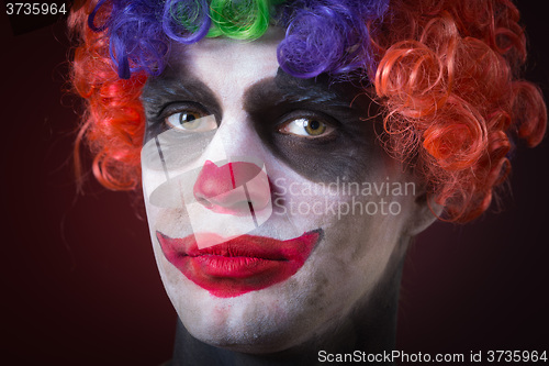 Image of Evil Spooky Clown Portrait on dark background. expressive man