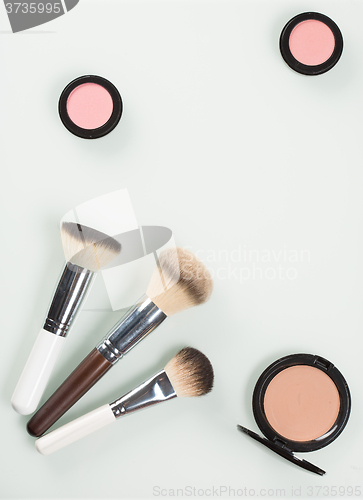 Image of Set of professional cosmetic: make-up brushes, shadows, Front part.