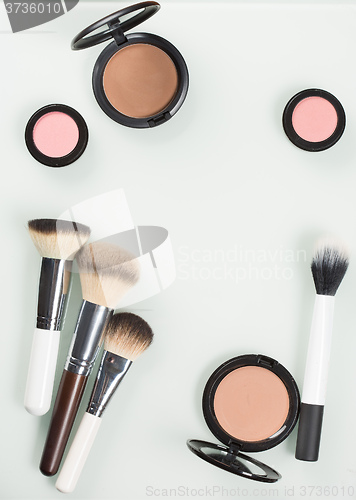 Image of Set of professional cosmetic: make-up brushes, shadows, Front part.