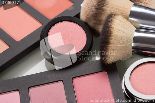 Image of makeup cosmetics. compact powder, mineral foundation and makeup brushes