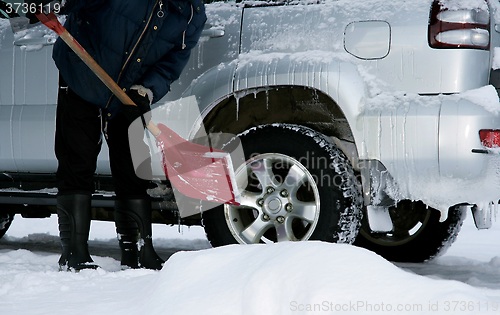 Image of Man shoveling snow