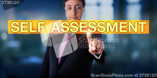 Image of Happy Manager Pressing SELF ASSESSMENT