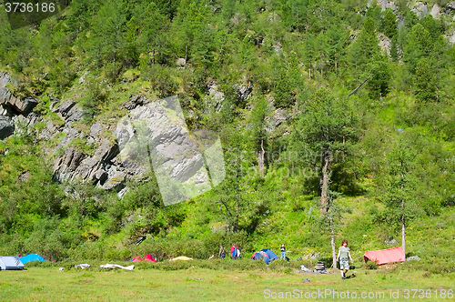 Image of Tourist tents in camp in mountain