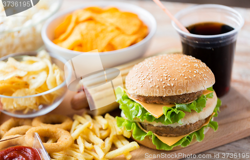 Image of close up of fast food snacks and drink on table