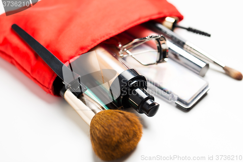 Image of close up of cosmetic bag with makeup stuff