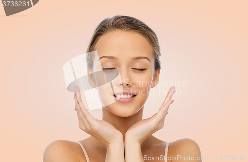 Image of smiling young woman face and hands