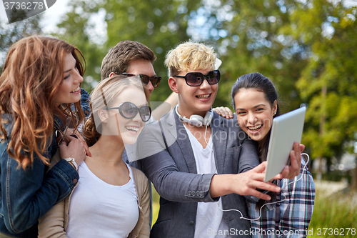 Image of students or teenagers with tablet pc taking selfie