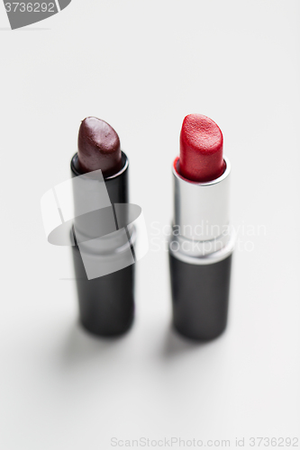 Image of close up of two open lipsticks