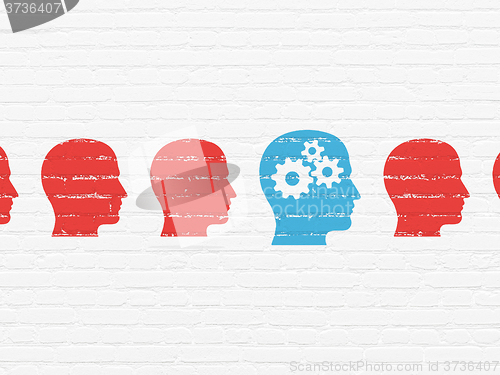Image of Learning concept: head with gears icon on wall background