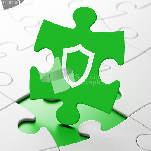 Image of Privacy concept: Contoured Shield on puzzle background