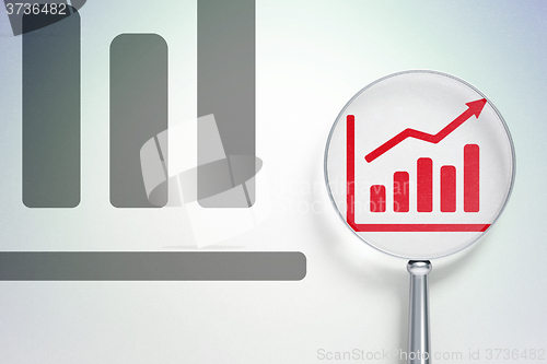 Image of Marketing concept:  Growth Graph with optical glass on digital background