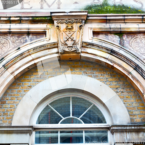 Image of old windon in england london brick and glass the wall 