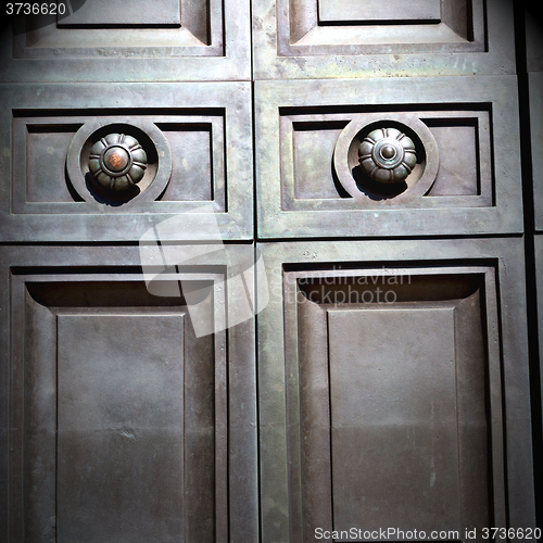 Image of in london antique brown door  rusty  brass nail and light