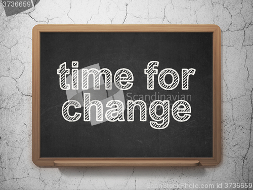 Image of Time concept: Time for Change on chalkboard background