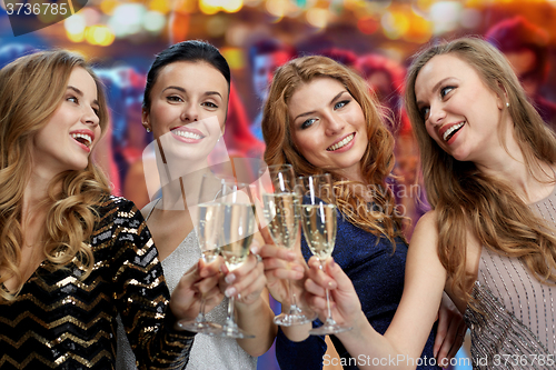 Image of happy women with champagne glasses over lights