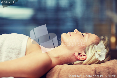 Image of young woman lying in spa