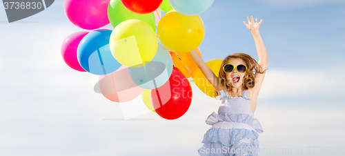 Image of happy jumping girl with colorful balloons