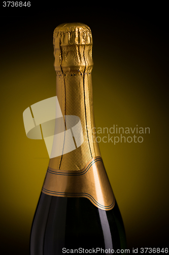 Image of close up of champagne bottle with blank label