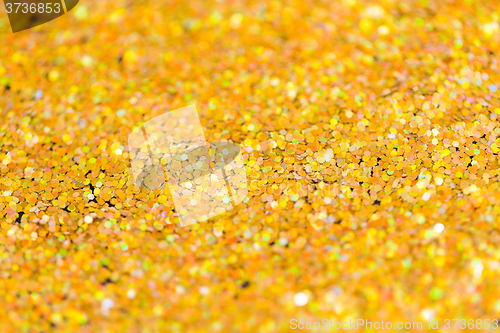Image of golden glitter or yellow sequins background