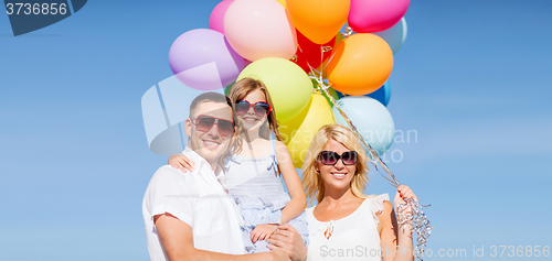 Image of family with colorful balloons