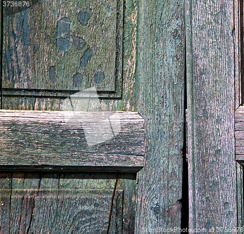 Image of texture   brown knocker and wood  door  