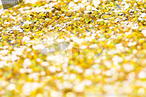 Image of golden glitter or yellow sequins background