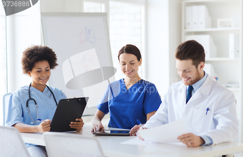 Image of group of happy doctors meeting at hospital office