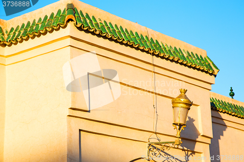 Image of tile roof  moroccan old wall and brick  