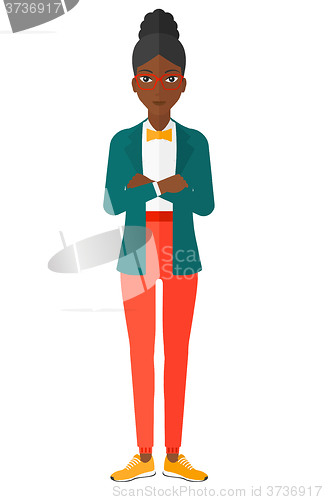 Image of Woman standing with crossed arms.