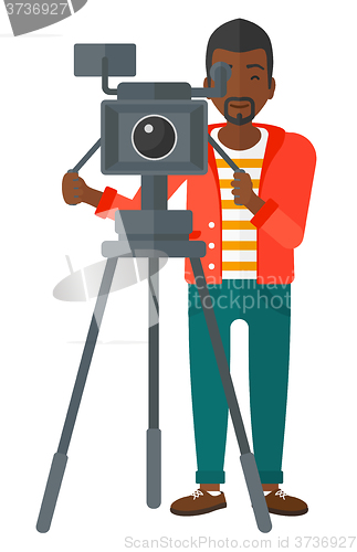 Image of Cameraman with movie camera.