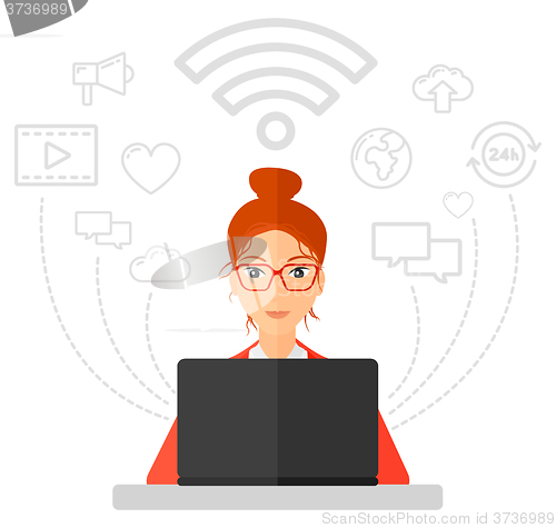 Image of Woman working on laptop.