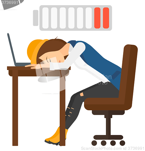 Image of Man sleeping at workplace.