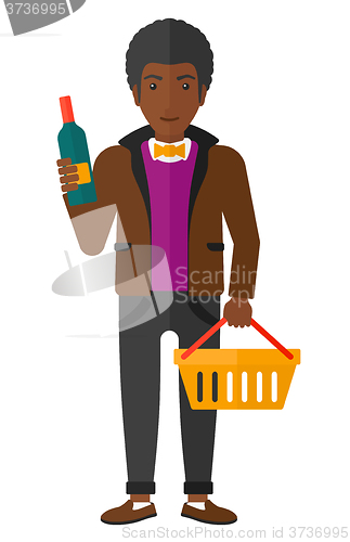 Image of Customer with shopping basket and bottle of wine.