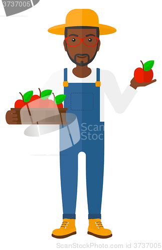 Image of Farmer collecting apples.