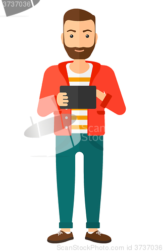 Image of Man using tablet computer.