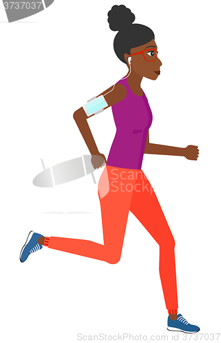 Image of Woman jogging with earphones and smartphone.