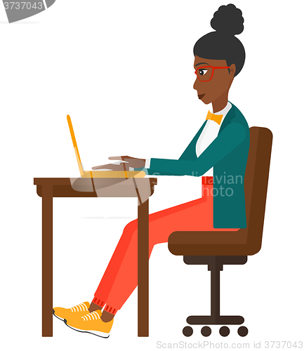 Image of Woman working at laptop.