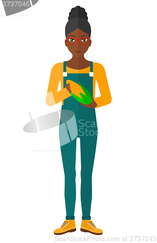 Image of Farmer holding corn.