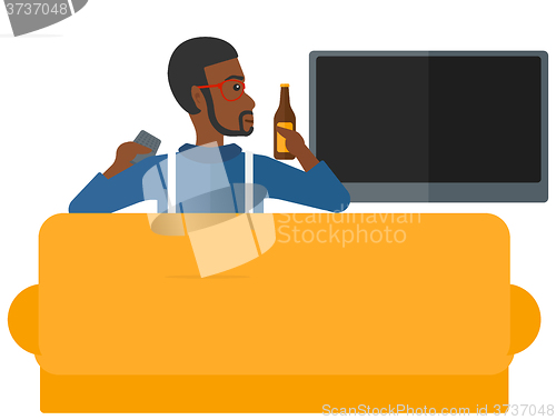Image of Man watching TV.