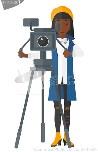 Image of Camerawoman with movie camera.