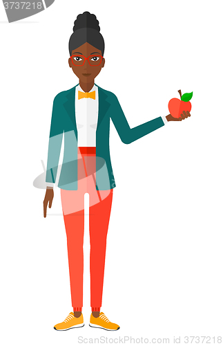 Image of Woman holding apple.