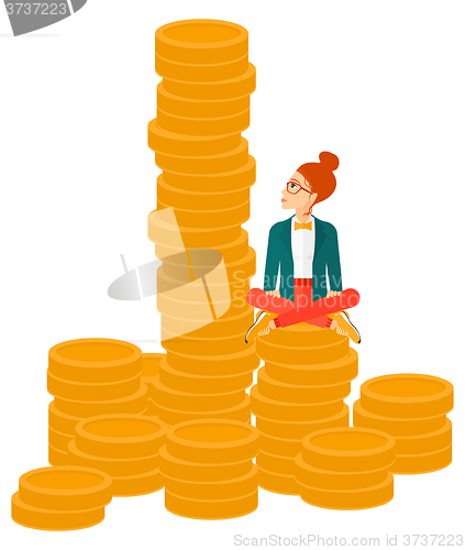 Image of Business woman sitting on gold.