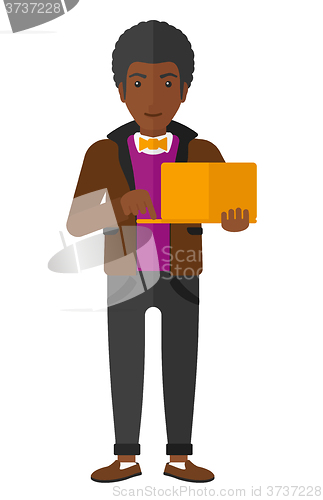 Image of Man using laptop.