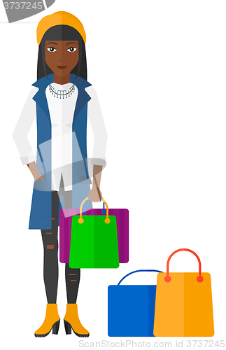 Image of Buyer with shopping bags.