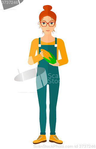 Image of Farmer holding corn.