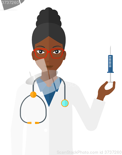 Image of Doctor holding syringe.