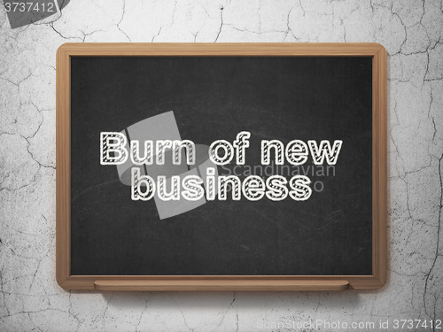 Image of Finance concept: Burn Of new Business on chalkboard background