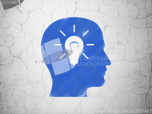 Image of Business concept: Head With Light Bulb on wall background