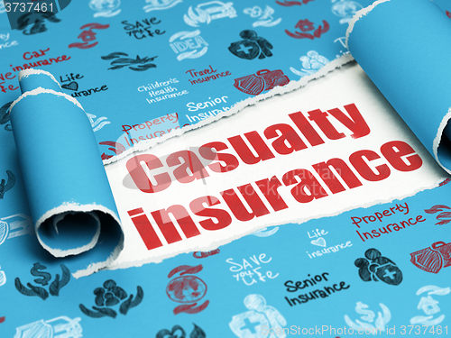 Image of Insurance concept: red text Casualty Insurance under the piece of  torn paper